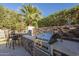 Outdoor kitchen with grill and seating area at 1620 E Azafran Trl, Queen Creek, AZ 85140