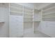 Large walk-in closet with ample shelving and drawer space at 1620 E Azafran Trl, Queen Creek, AZ 85140