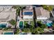 Aerial view showing home with solar panels, pool, and large backyard at 2415 W Weatherby Way, Chandler, AZ 85286