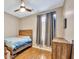 Bedroom featuring a wood bed frame and window at 2415 W Weatherby Way, Chandler, AZ 85286