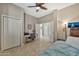 Bedroom with desk, chair, and ceiling fan at 2415 W Weatherby Way, Chandler, AZ 85286