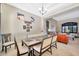 Dining room with a wood table and chairs, adjacent to the living room at 2415 W Weatherby Way, Chandler, AZ 85286