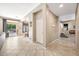 View of a hallway with tile floors and access to various rooms at 2415 W Weatherby Way, Chandler, AZ 85286