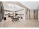 Kitchen with white cabinets, an island, and a dining area at 2415 W Weatherby Way, Chandler, AZ 85286