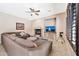 Comfortable living room featuring a sectional sofa and a fireplace at 2415 W Weatherby Way, Chandler, AZ 85286