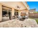 Relaxing patio with seating area and view of backyard at 2415 W Weatherby Way, Chandler, AZ 85286