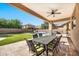 Covered patio with dining table and chairs, adjacent to the pool at 2415 W Weatherby Way, Chandler, AZ 85286