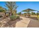 Community playground with shaded areas and play equipment at 2415 W Weatherby Way, Chandler, AZ 85286