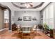 Charming dining room with a round table, four chairs, and wood floors at 3121 S Verde Cir, Mesa, AZ 85212