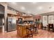 Spacious kitchen featuring an island, wood cabinets, and stainless steel appliances at 3121 S Verde Cir, Mesa, AZ 85212