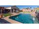 Inviting pool with waterfall feature and spacious deck at 3121 S Verde Cir, Mesa, AZ 85212