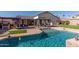 Large backyard pool with a covered patio and outdoor kitchen at 3121 S Verde Cir, Mesa, AZ 85212