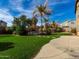 Landscaped backyard featuring a pool and patio area at 319 E Palomino Way, San Tan Valley, AZ 85143