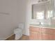 Simple bathroom with toilet, sink, and vanity at 319 E Palomino Way, San Tan Valley, AZ 85143