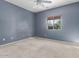 Bright bedroom with ceiling fan and neutral walls at 319 E Palomino Way, San Tan Valley, AZ 85143