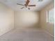 Spacious bedroom with ceiling fan and neutral decor at 319 E Palomino Way, San Tan Valley, AZ 85143