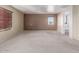 Large bedroom with carpeted floor and two windows at 319 E Palomino Way, San Tan Valley, AZ 85143