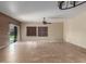 Bright Gathering room with tile floors, ceiling fan, and sliding glass doors at 319 E Palomino Way, San Tan Valley, AZ 85143