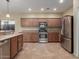 Spacious kitchen with stainless steel appliances and ample cabinetry at 319 E Palomino Way, San Tan Valley, AZ 85143