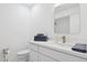 Modern bathroom featuring a stylish vanity, elegant mirror, and sleek sink with ample counter space at 342 E Orangewood Ave, Phoenix, AZ 85020