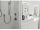 Updated bathroom with modern shower and double sink vanity at 342 E Orangewood Ave, Phoenix, AZ 85020