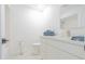 Bright bathroom featuring a toilet, a modern vanity with towels, and a tiled shower at 342 E Orangewood Ave, Phoenix, AZ 85020