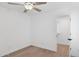 Bright bedroom with hardwood floors, modern ceiling fan, and walk in closet for ample storage at 342 E Orangewood Ave, Phoenix, AZ 85020