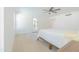 Well-lit bedroom with a ceiling fan and access to the outdoors at 342 E Orangewood Ave, Phoenix, AZ 85020