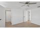 Bright bedroom features sleek ceiling fan, and an organized walk-in closet, creating a serene, modern space at 342 E Orangewood Ave, Phoenix, AZ 85020