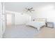 Spacious, brightly lit bedroom with a ceiling fan and stylish decor at 342 E Orangewood Ave, Phoenix, AZ 85020