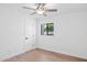 Bright bedroom with hardwood floors, a modern ceiling fan, and a window for natural light at 342 E Orangewood Ave, Phoenix, AZ 85020