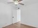 Bright bedroom with hardwood floors and ceiling fan, creating a peaceful and inviting atmosphere at 342 E Orangewood Ave, Phoenix, AZ 85020