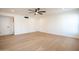 Light-filled bedroom featuring hardwood floors and ceiling fan at 342 E Orangewood Ave, Phoenix, AZ 85020