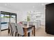 Bright dining area flows into the updated kitchen and offers views of the backyard pool at 342 E Orangewood Ave, Phoenix, AZ 85020