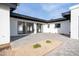 Backyard patio with pavers, and sliding glass doors leading to the interior at 342 E Orangewood Ave, Phoenix, AZ 85020