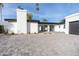 Modern home exterior with white brick and a black garage door at 342 E Orangewood Ave, Phoenix, AZ 85020