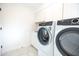 Bright laundry room with modern washer and dryer at 342 E Orangewood Ave, Phoenix, AZ 85020