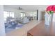 Open-concept living room showcases contemporary decor and flows seamlessly into the kitchen area at 342 E Orangewood Ave, Phoenix, AZ 85020
