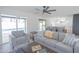 Bright living room features modern design, an open floor plan, and a view of the pool area at 342 E Orangewood Ave, Phoenix, AZ 85020