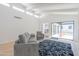 Bright living room with modern furnishings and a view of the outdoor patio at 342 E Orangewood Ave, Phoenix, AZ 85020