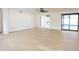 Living room with hardwood floors, sliding glass doors opening to the pool area at 342 E Orangewood Ave, Phoenix, AZ 85020