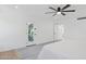 Primary bedroom offers an exterior door and a ceiling fan at 342 E Orangewood Ave, Phoenix, AZ 85020