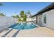 Beautiful backyard featuring a sparkling pool, lush landscaping, and an expansive outdoor patio at 342 E Orangewood Ave, Phoenix, AZ 85020