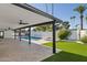 View of backyard oasis with refreshing pool and covered patio at 342 E Orangewood Ave, Phoenix, AZ 85020