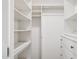 Well-organized walk-in closet with built-in shelving and drawers provides ample storage space at 342 E Orangewood Ave, Phoenix, AZ 85020