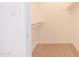 Bright walk-in closet with built-in shelving and hardwood floors, providing plenty of storage space at 342 E Orangewood Ave, Phoenix, AZ 85020
