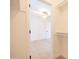 Bright walk-in closet with ample storage space and views to the bedroom with ceiling fan and hardwood floors at 342 E Orangewood Ave, Phoenix, AZ 85020
