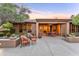 Charming backyard featuring an inviting patio area, desert plants, and cozy seating arrangements for relaxation at 3799 N 154Th Dr, Goodyear, AZ 85395