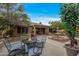 Relaxing backyard with a fire pit, seating areas, a fountain, and beautiful landscaping at 3799 N 154Th Dr, Goodyear, AZ 85395