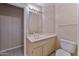 Bright bathroom featuring a single sink vanity, mirror, and a toilet at 3799 N 154Th Dr, Goodyear, AZ 85395